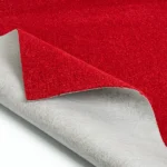 Red carpet swatch showing gray felt backing.