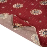 Red carpet swatch showing white felt backing