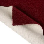 Red carpet swatch showing woven felt backing