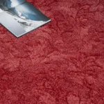 Red patterned carpet with a book
