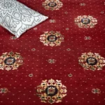 Red ribbed carpet with a white figurine