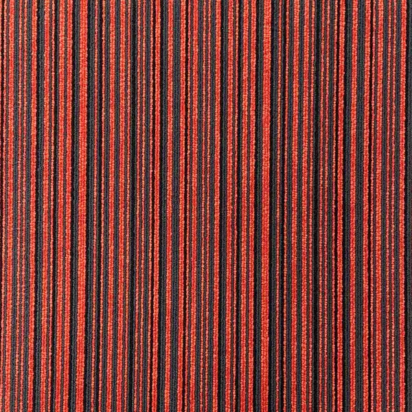 Striped red carpet tile with orange and black accents